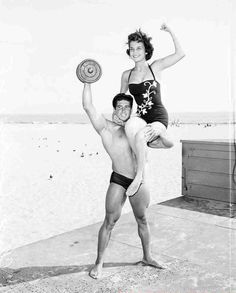 Reg Parks lifting heavy weights and a girl